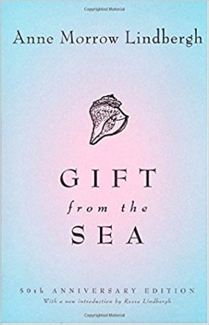 Gift From the Sea by Anne Morrow Lindbergh (cover) black text over a blue and pink background (a seashell above the title)