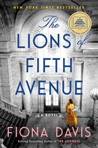 The Lions of Fifth Avenue by Fiona Davis (cover) Image: a woman in a yellow dress stands with an open book inside a large museum type room