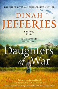 Daughters of War by Dinah Jefferies (cover) Image: a woman stands with her back to the camera in a field with trees and a house on a hill in the distance